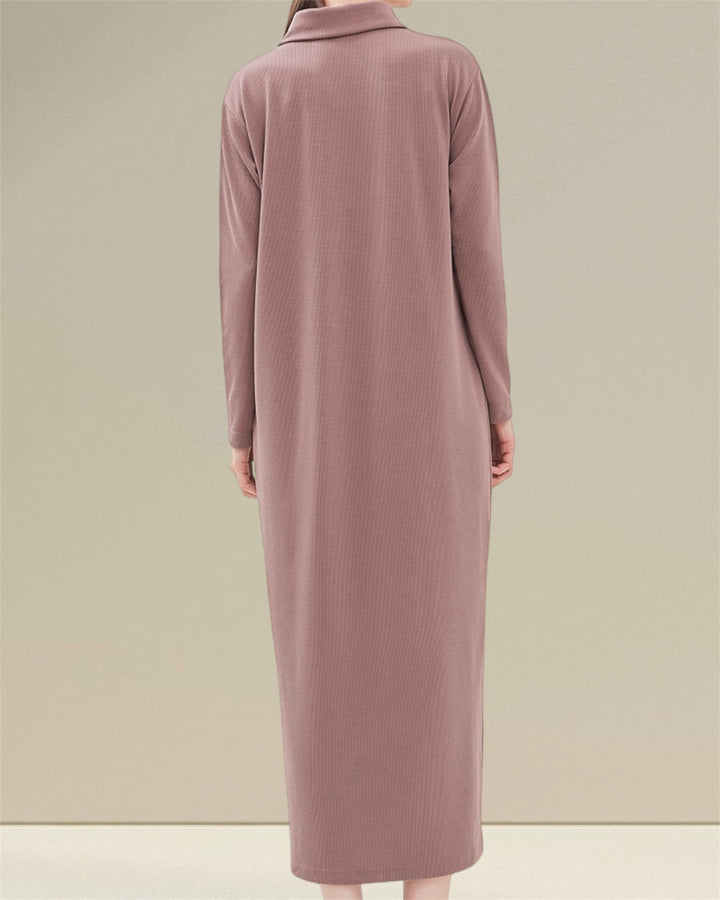 Huda Nursing Dress made from 94% polyester and 6% spandex, featuring soft, elastic fabric for comfort. The dress includes practical buttons and vertical openings on each side for discreet breastfeeding, making it ideal for both pregnancy and nursing, blending elegance and ease