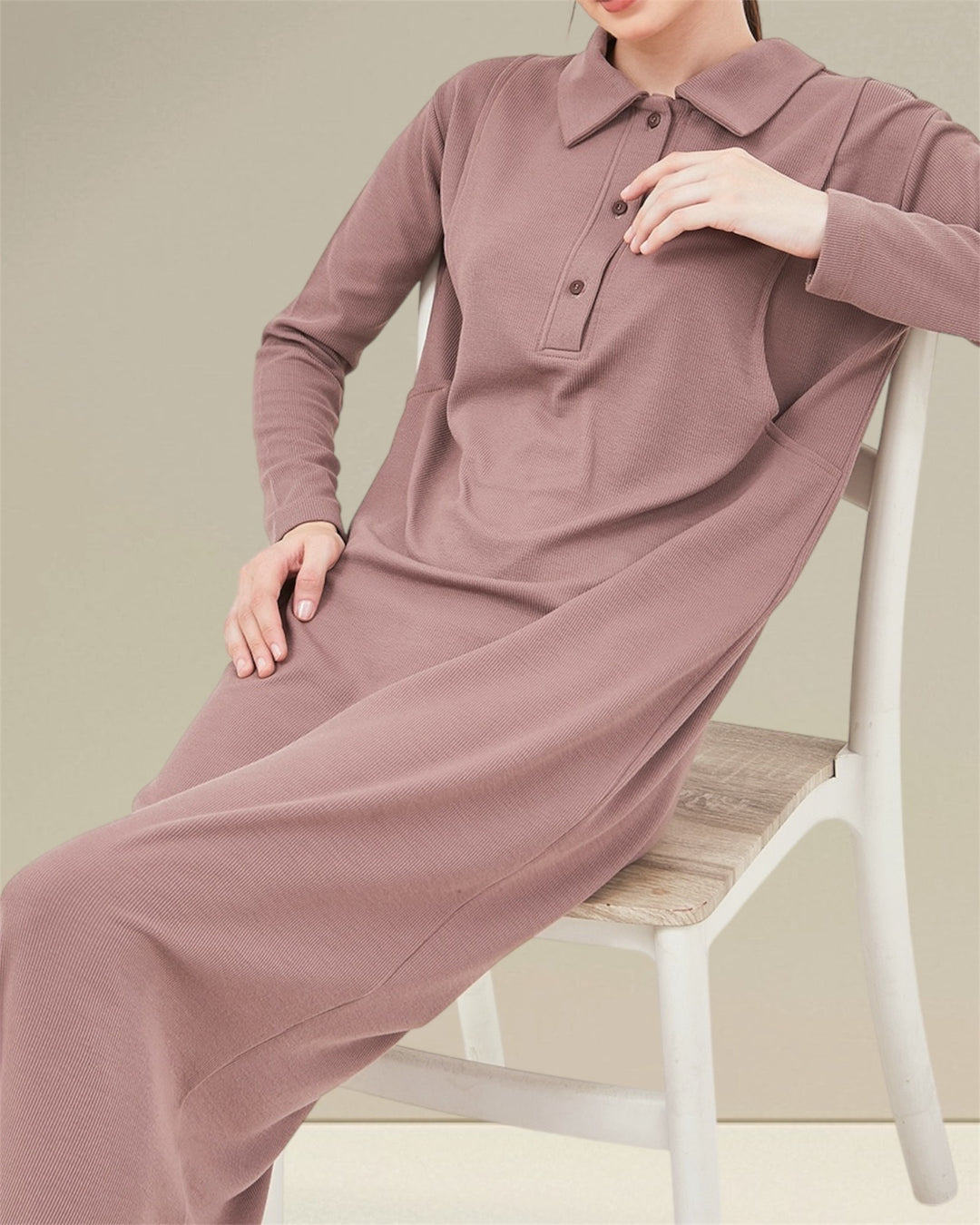 Discover the Huda Nursing Dress, providing comfort throughout the day. With its practical button closures and vertical openings designed for breastfeeding, mothers can enjoy easy access while looking great. The Huda Nursing Dress is a versatile piece suitable for both pregnancy and breastfeeding