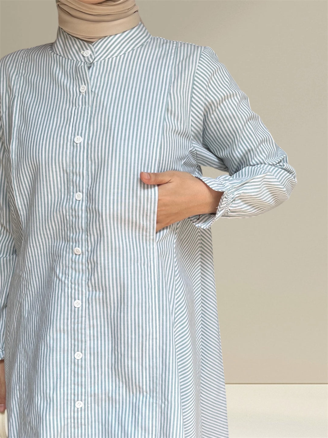 Aliya Nursing Top in white and green stripes, made from breathable fabric for all-day comfort, this relaxed-fit top provides ample room for movement and coverage.