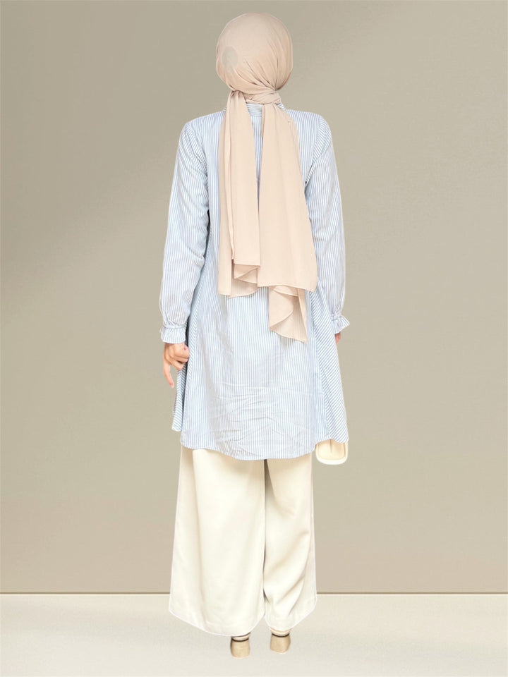 Aliya Nursing Top in white and green stripes, Its timeless striped pattern adds elegance to your wardrobe, easily pairing with jeans or leggings for various occasions. The Aliya Nursing Top combines comfort, fashion, and practicality for confident and stylish nursing