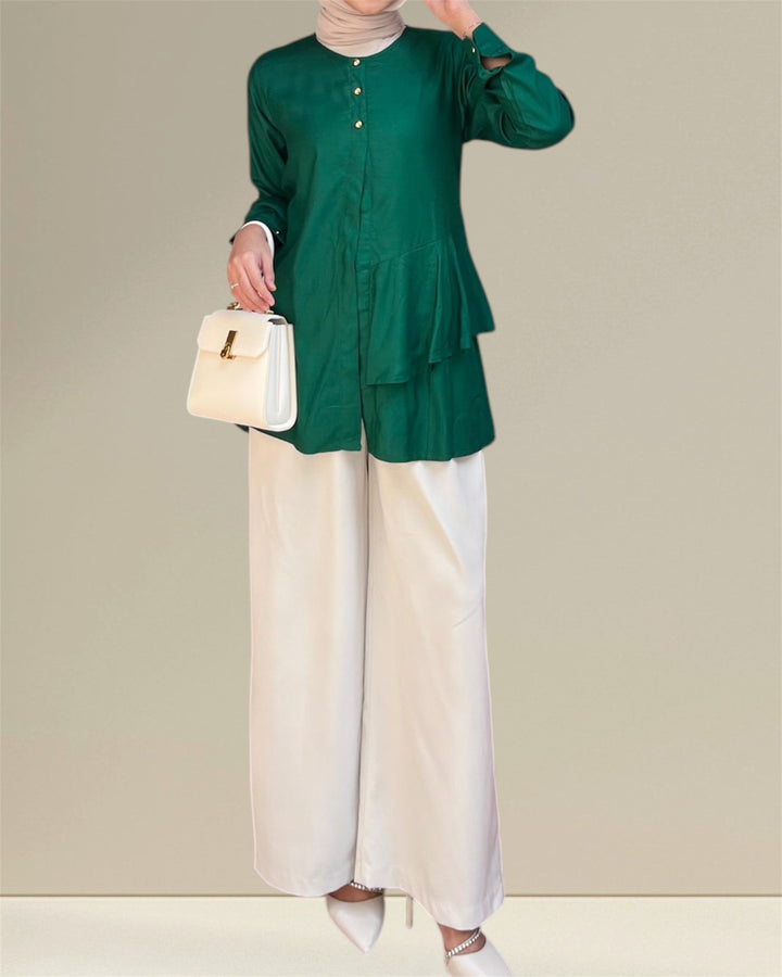 Aira Nursing Top in emerald green, crafted from premium rayon fabric for soft, breathable, and lightweight comfort. Designed for easy breastfeeding access, this nursing wear provides a discreet and convenient solution for nursing moms on the go. Featuring a loose and flowy fit for full coverage and elegance, the vibrant emerald shade adds sophistication to your wardrobe, making it a versatile choice for postpartum and maternity fashion