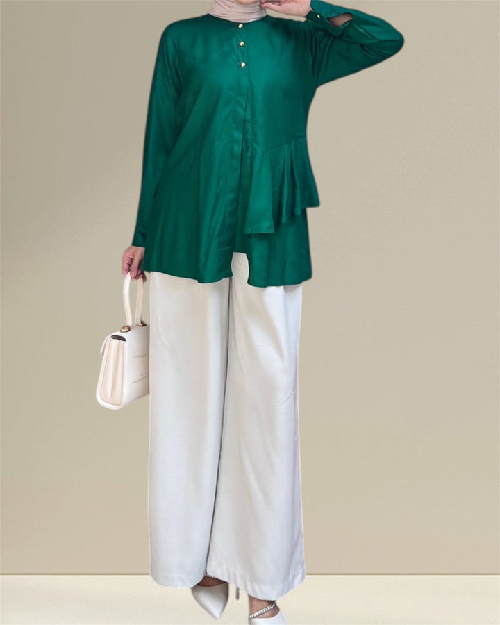 Aira Nursing Top in emerald green, crafted from premium rayon fabric for soft, breathable, and lightweight comfort. Designed for easy breastfeeding access, this nursing wear provides a discreet and convenient solution for nursing moms on the go. Featuring a loose and flowy fit for full coverage and elegance, the vibrant emerald shade adds sophistication to your wardrobe, making it a versatile choice for postpartum and maternity fashion