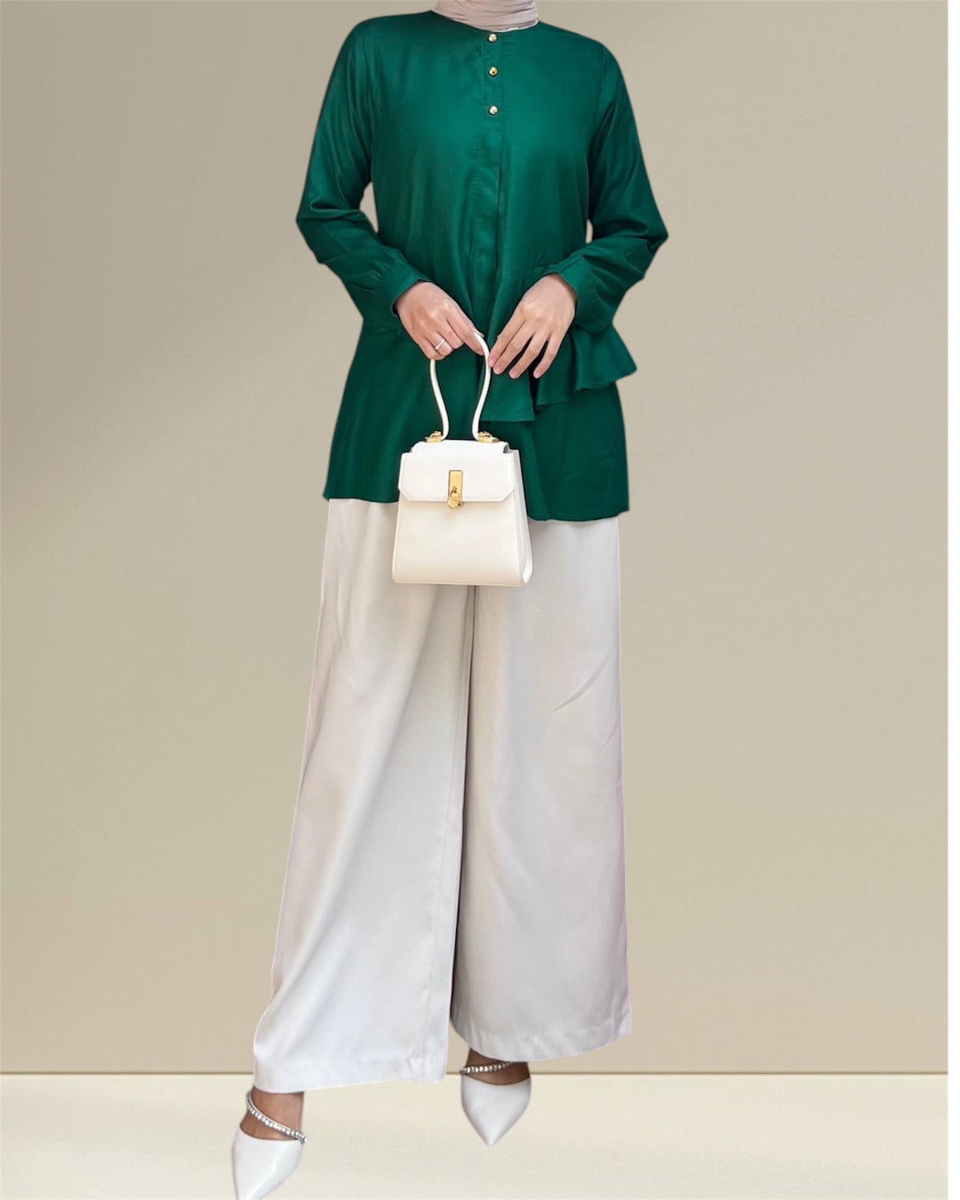 Aira Nursing Top in emerald green, crafted from premium rayon fabric for soft, breathable, and lightweight comfort. Designed for easy breastfeeding access, this nursing wear provides a discreet and convenient solution for nursing moms on the go. Featuring a loose and flowy fit for full coverage and elegance, the vibrant emerald shade adds sophistication to your wardrobe, making it a versatile choice for postpartum and maternity fashion