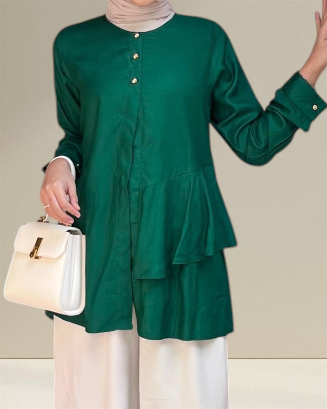 Aira Nursing Top in emerald green, crafted from premium rayon fabric for soft, breathable, and lightweight comfort. Designed for easy breastfeeding access, this nursing wear provides a discreet and convenient solution for nursing moms on the go. Featuring a loose and flowy fit for full coverage and elegance, the vibrant emerald shade adds sophistication to your wardrobe, making it a versatile choice for postpartum and maternity fashion