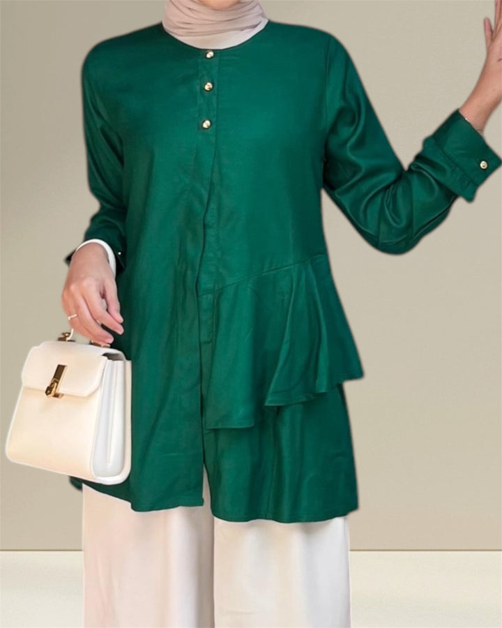 Aira Nursing Top in emerald green, crafted from premium rayon fabric for soft, breathable, and lightweight comfort. Designed for easy breastfeeding access, this nursing wear provides a discreet and convenient solution for nursing moms on the go. Featuring a loose and flowy fit for full coverage and elegance, the vibrant emerald shade adds sophistication to your wardrobe, making it a versatile choice for postpartum and maternity fashion