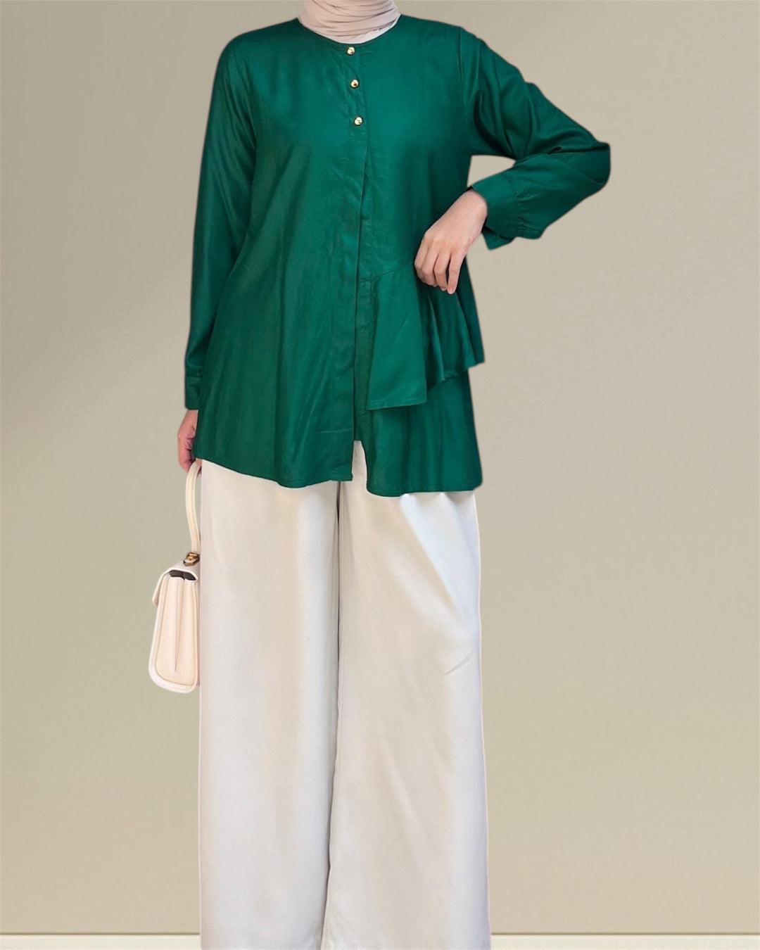 Aira Nursing Top in emerald green, crafted from premium rayon fabric for soft, breathable, and lightweight comfort. Designed for easy breastfeeding access, this nursing wear provides a discreet and convenient solution for nursing moms on the go. Featuring a loose and flowy fit for full coverage and elegance, the vibrant emerald shade adds sophistication to your wardrobe, making it a versatile choice for postpartum and maternity fashion