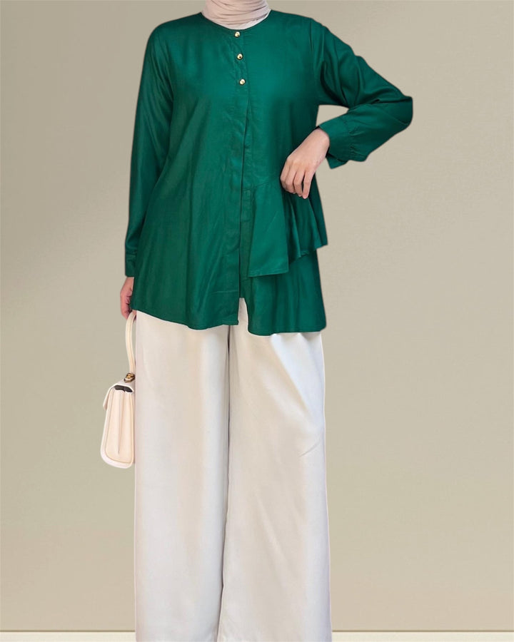 Aira Nursing Top in emerald green, crafted from premium rayon fabric for soft, breathable, and lightweight comfort. Designed for easy breastfeeding access, this nursing wear provides a discreet and convenient solution for nursing moms on the go. Featuring a loose and flowy fit for full coverage and elegance, the vibrant emerald shade adds sophistication to your wardrobe, making it a versatile choice for postpartum and maternity fashion
