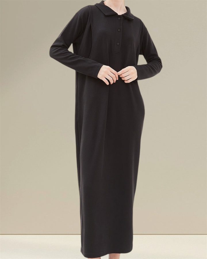 Huda Long Nursing Dress made from 94% polyester and 6% spandex yuki rib knit, featuring an elastic and smooth feel for all-day comfort. The dress includes practical buttons for easy wear and vertical openings on both sides for discreet breastfeeding, making it ideal for both pregnancy and nursing while combining style and functionality."