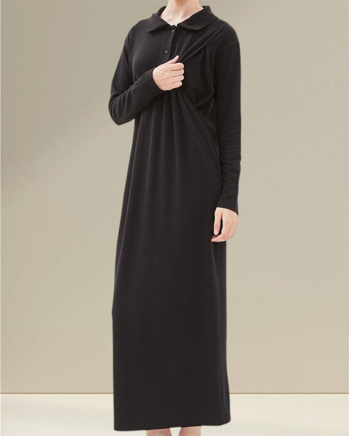 Huda Long Nursing Dress made from 94% polyester and 6% spandex yuki rib knit, featuring an elastic and smooth feel for all-day comfort. The dress includes practical buttons for easy wear and vertical openings on both sides for discreet breastfeeding, making it ideal for both pregnancy and nursing while combining style and functionality."