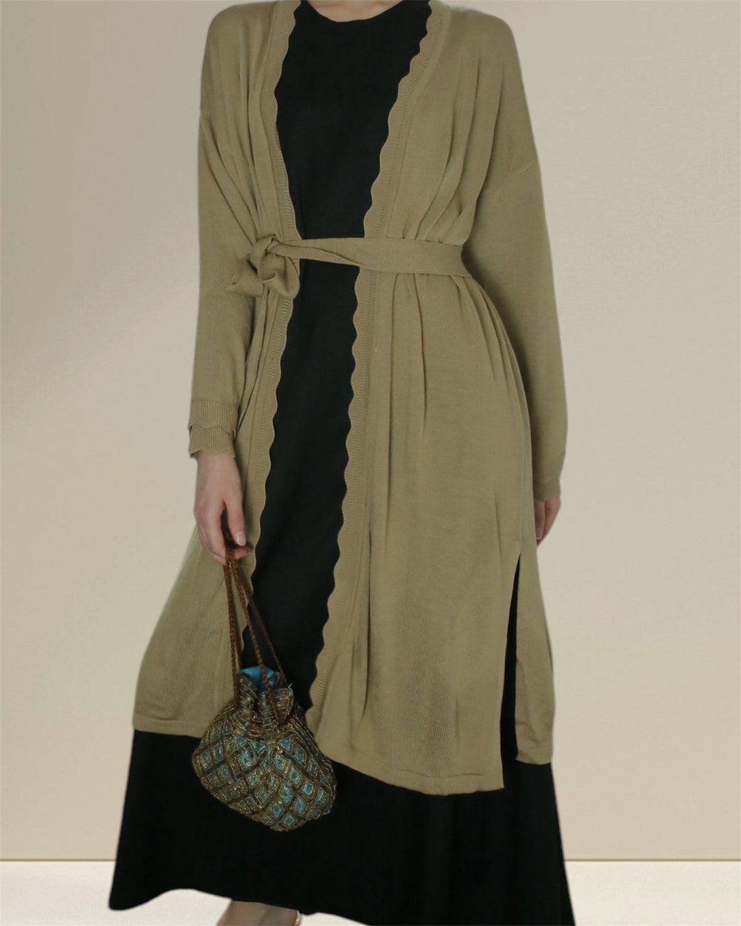 Breastfeeding Comfortable and elegant Jannah Set designed for breastfeeding, featuring a soft olive green cardigan and a sleek nursing black dress. The relaxed fit and practical breastfeeding access make it perfect for nursing moms.