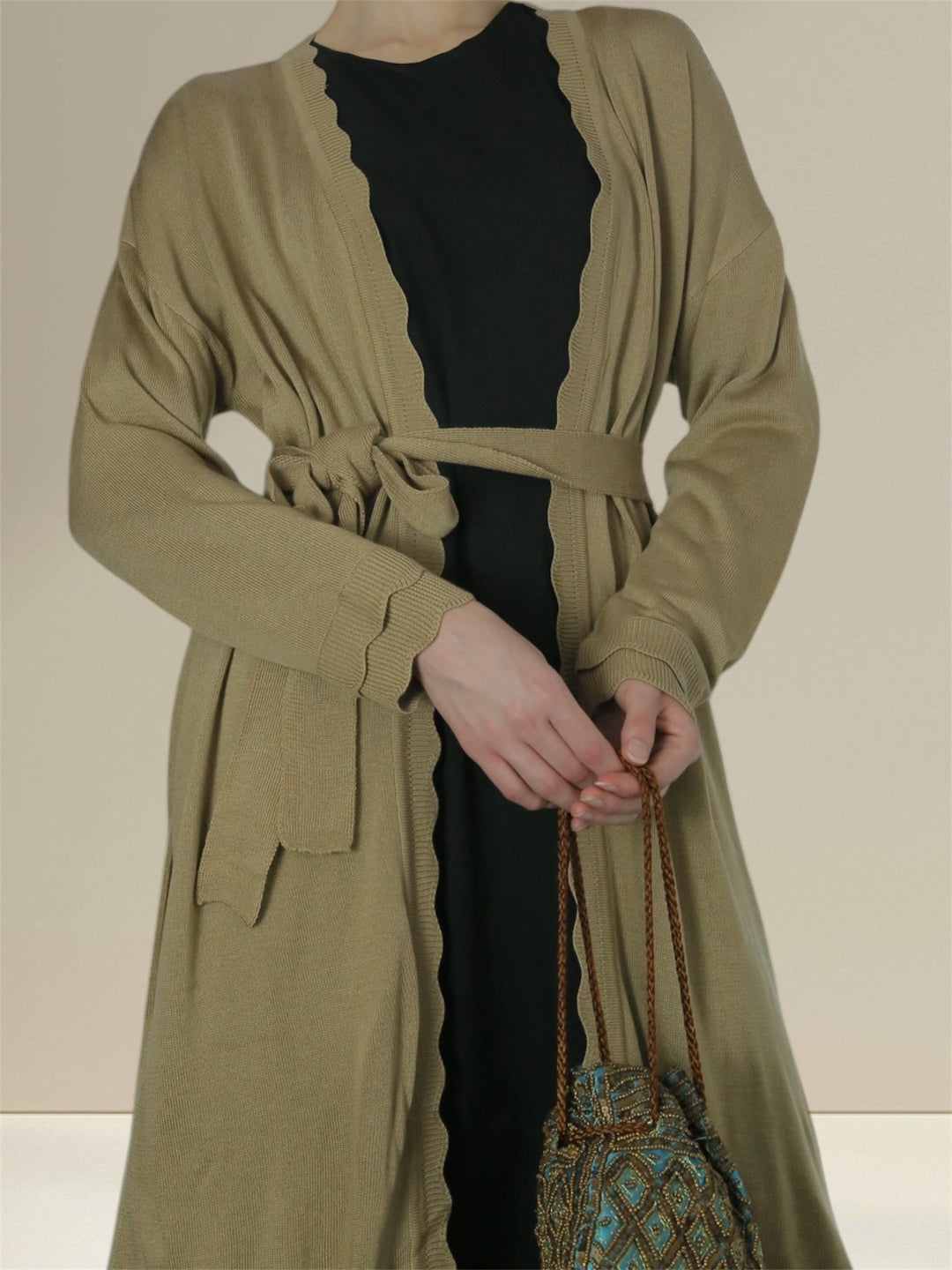 Breastfeeding Stylish breastfeeding clothes, the Jannah Set includes an olive green cardigan over a black nursing dress, offering both modesty and functionality. Ideal for nursing discreetly while maintaining a contemporary look.